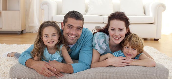 Family On Floor In Living-room